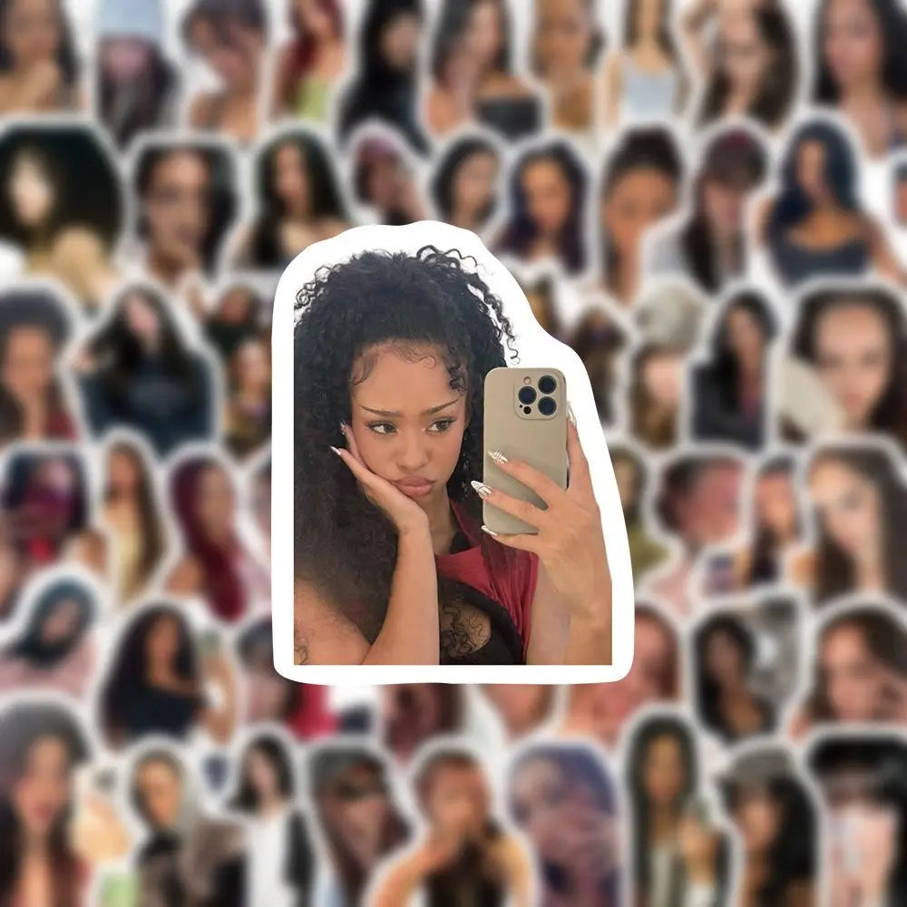 A person holding a silver smartphone with a triple-camera in a selfie pose featuring 100pcs set kpop katseye stickers megan fans gift