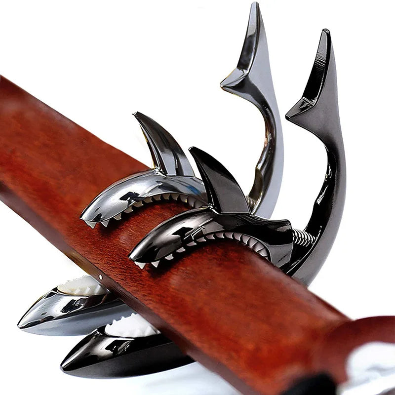 Metal shark capo with sharp serrated teeth and reflective zinc alloy finish for electric guitar tone and clip bass bridge use