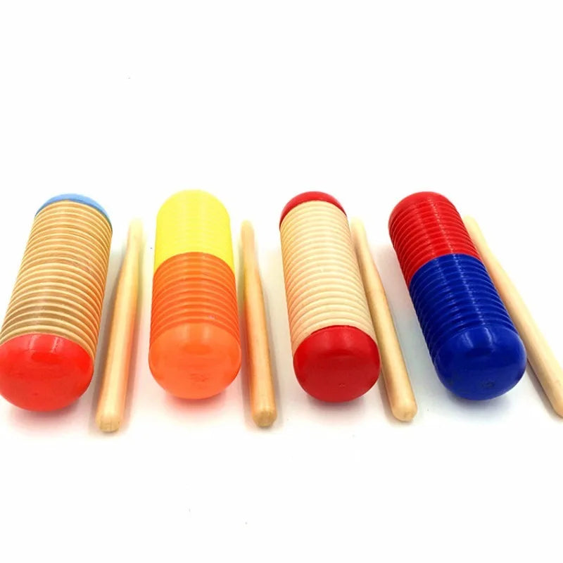Set of four colorful wooden guiro music toys tool percussion with vibrant red yellow orange and blue colors for child early educational use