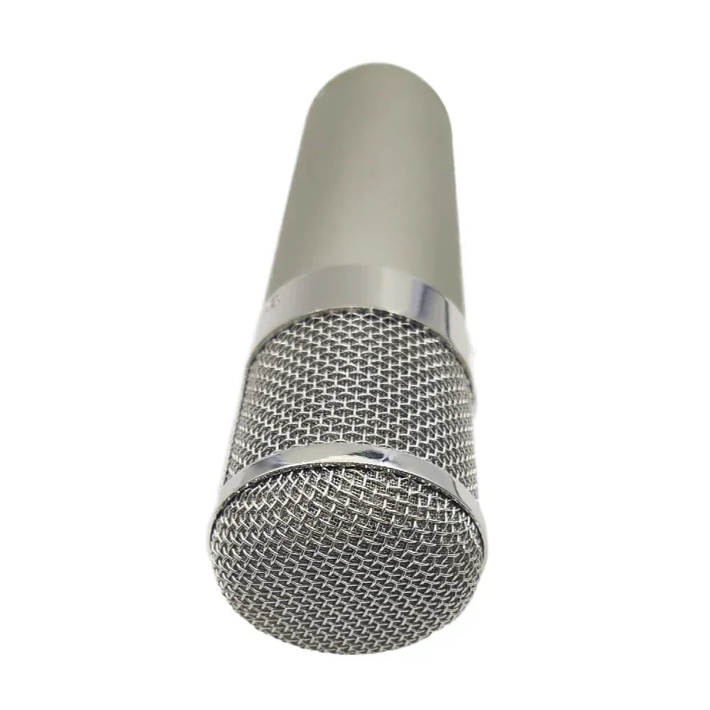 Silver condenser microphone ma-u47 with metallic mesh grille and chrome accents for professional studio recordings