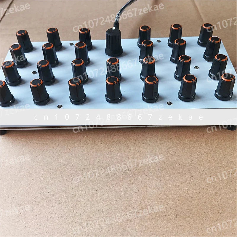 Black cylindrical midi knobs knob with copper-colored tops on gray panel connected by usb-c for host software controller