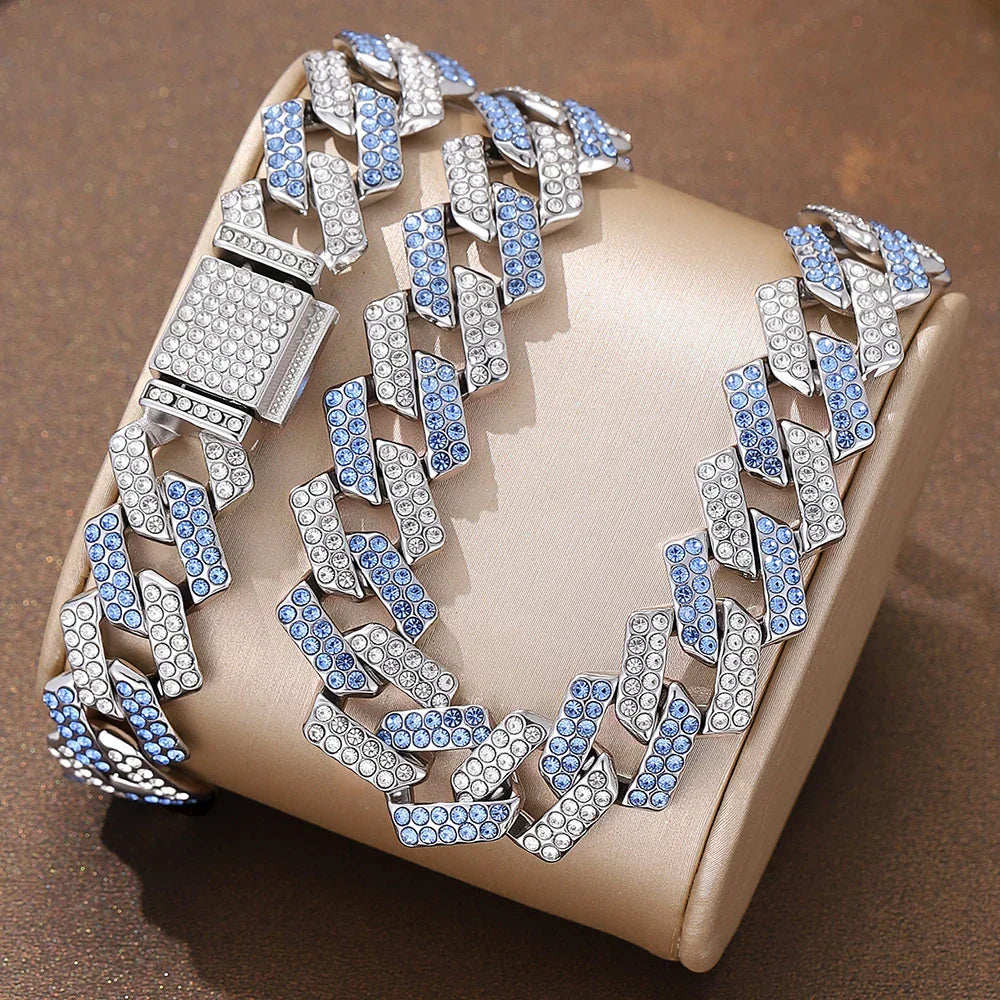 A sparkling silver and blue crystal 2pcs jewelry set featuring a high quality hip hop geometric cuban chain bracelet