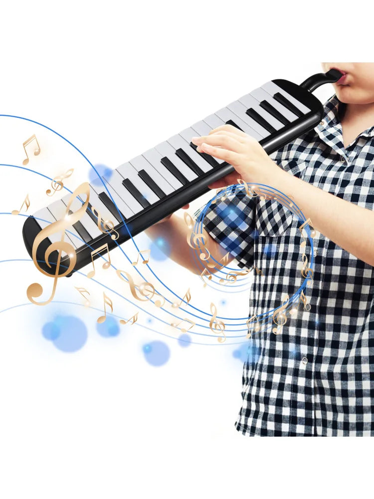 Black and white keys melodica instrument with soft blow pipe and gold musical notes swirling around pipe blowing nozzles