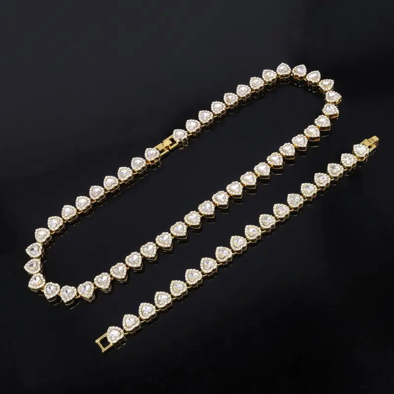 Gold-tone heart-shaped tennis chain bracelet with shiny heart rhinestone accents for rock party jewelry looks