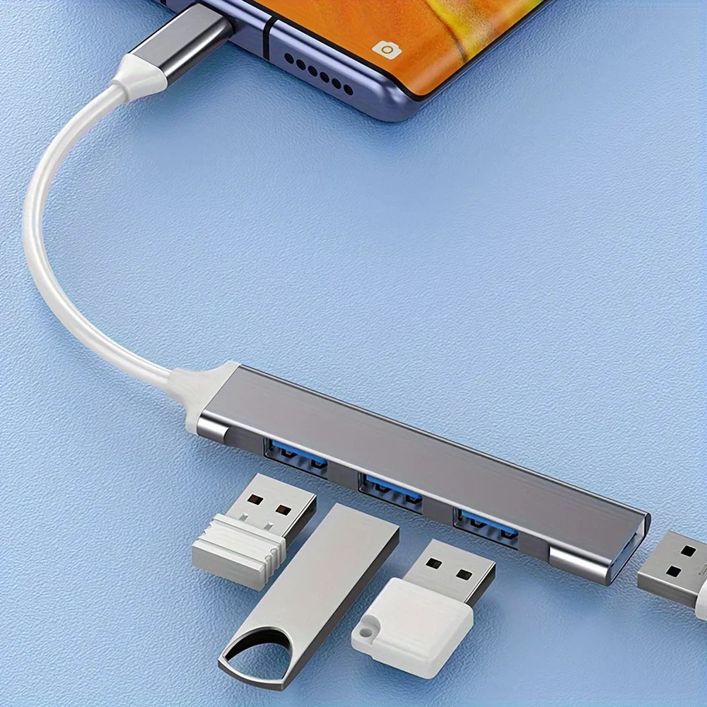 Silver usb dock with four blue ports and white cable wire divider high speed drag four expanders for phones and computers