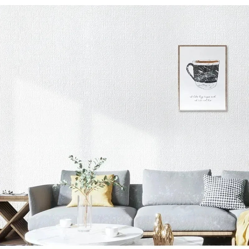 Gray velvet sofa with yellow and black and white pillows against 50cm self adhesive foam wall panel for living room decor