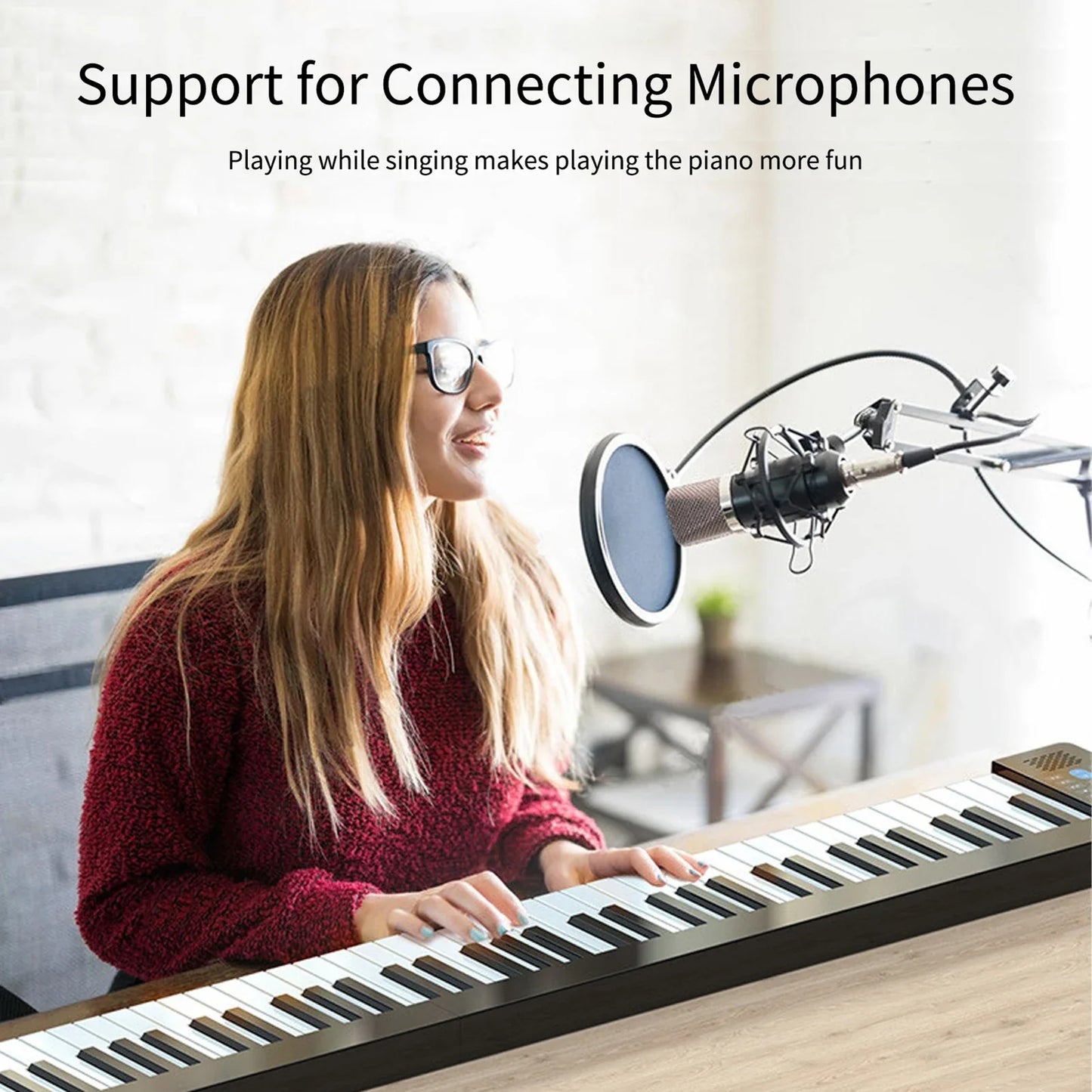Black and white 61-key foldable electronic piano with multifunctional electronic organ features rechargeable bt connectivity and microphone stand