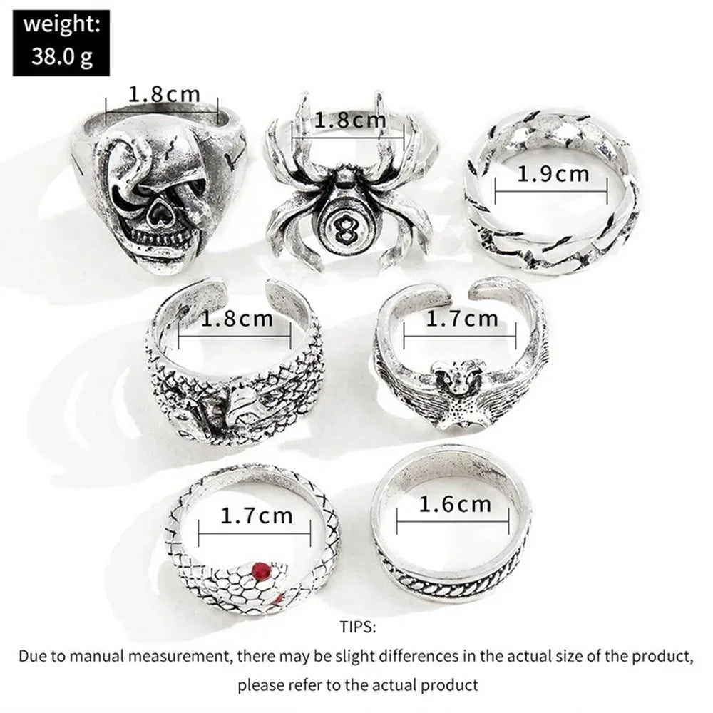 Set of seven silver-toned stainless steel men ring vintage featuring spider bat skull and two-headed snake designs with red gemstones