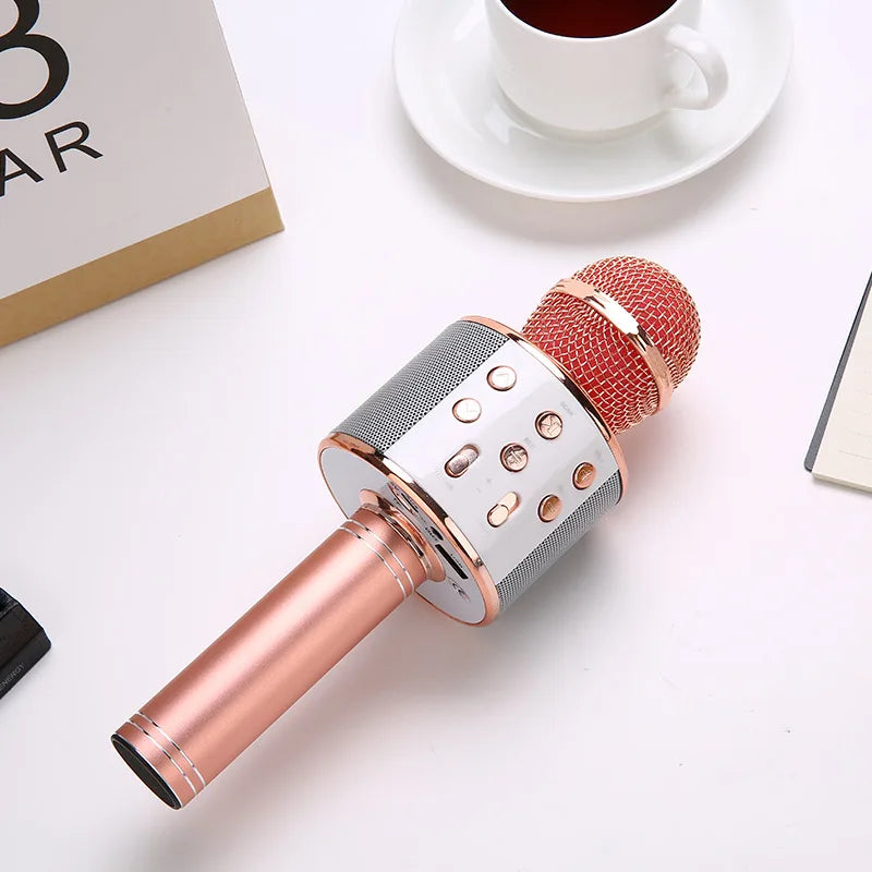 Rose gold wireless karaoke microphone with red mesh grille and silver control panel for stable connection and multiple compatible devices