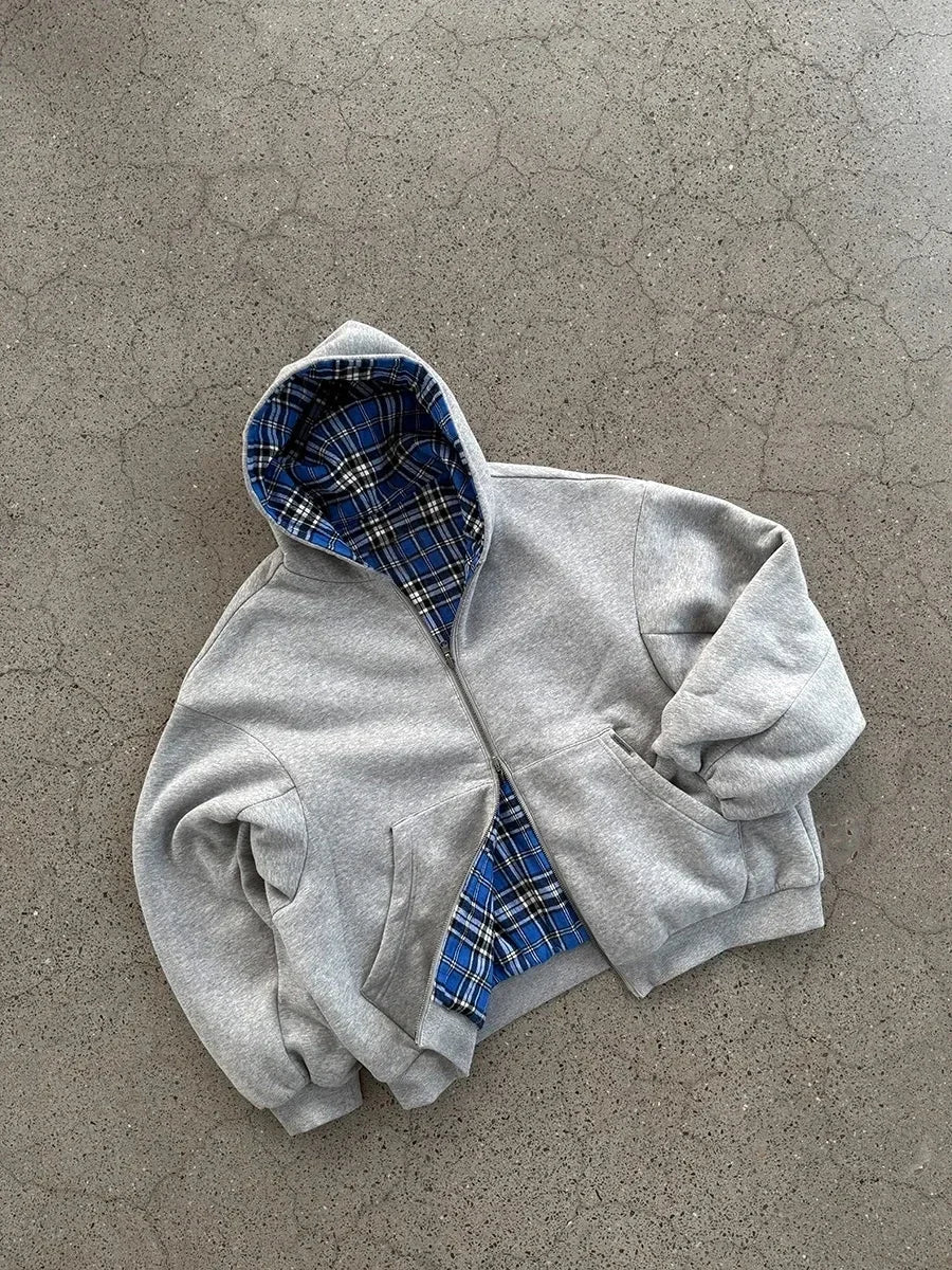 Gray hooded sweatshirt with blue and black plaid lining featuring casual joker sweatshirt style for hoodie men y2k look