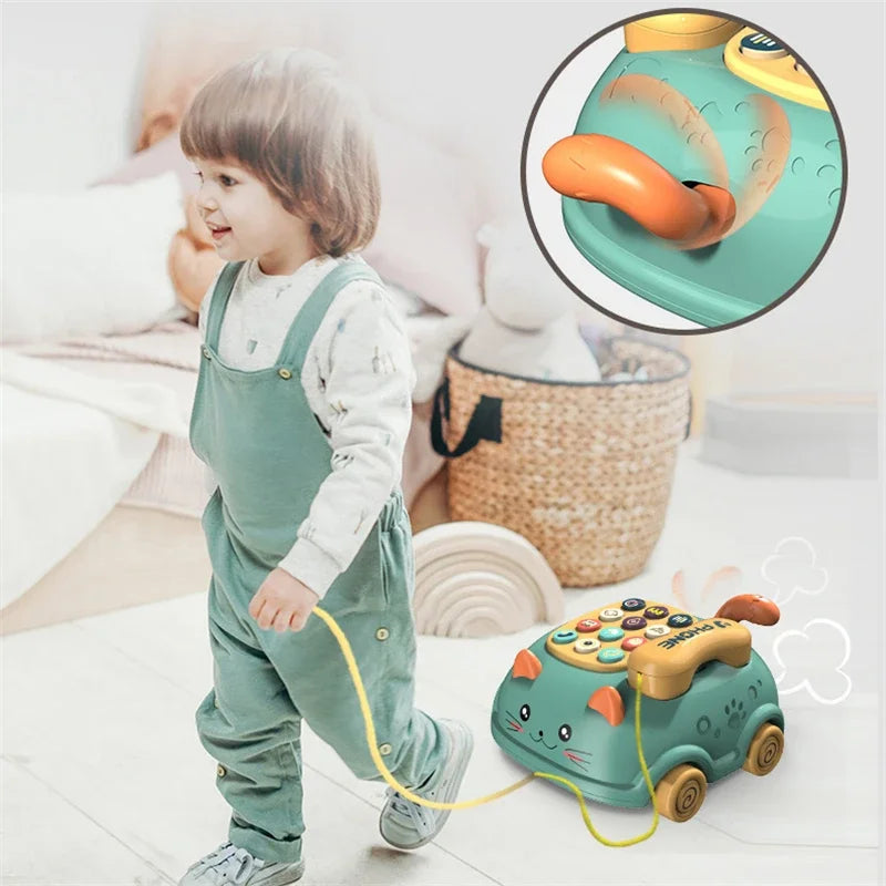 Teal and yellow cat-shaped 3-in-1 musical phone toy with orange handle and buttons for toddler interactive learning and early education montessori
