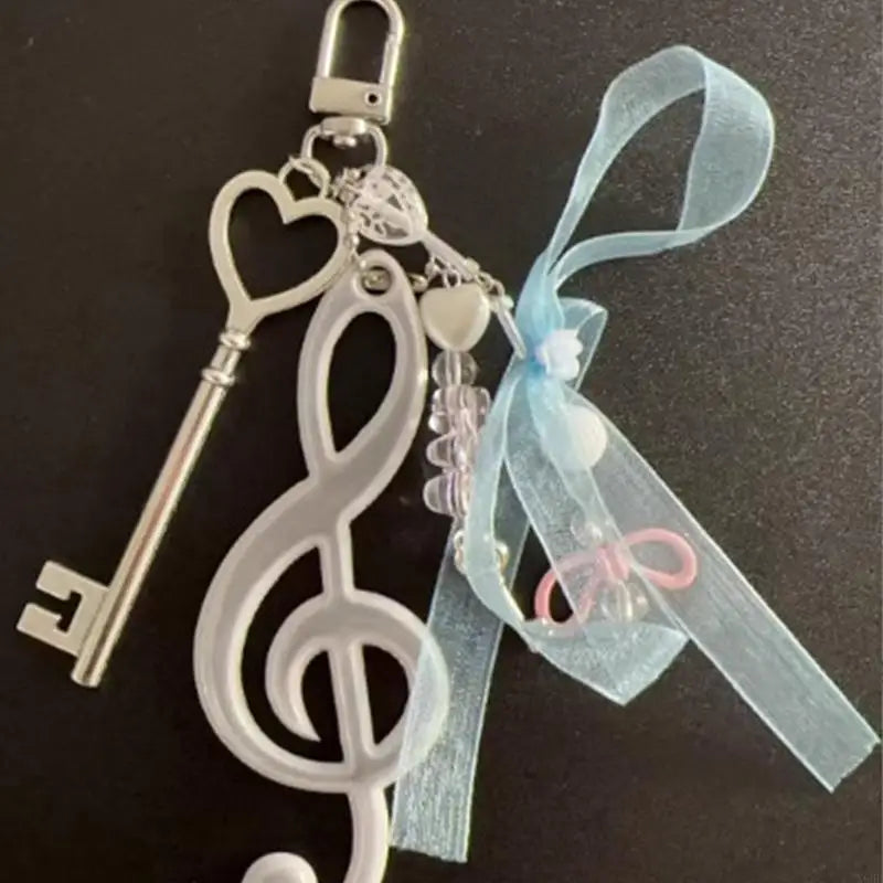 Silver heart-shaped music symbol keyring with treble clef design beads and light blue ribbon note keychain bowknot