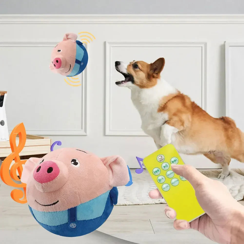 Pink plush pig electronic pet dog toy ball with blue body features embroidered face for interactive dog play
