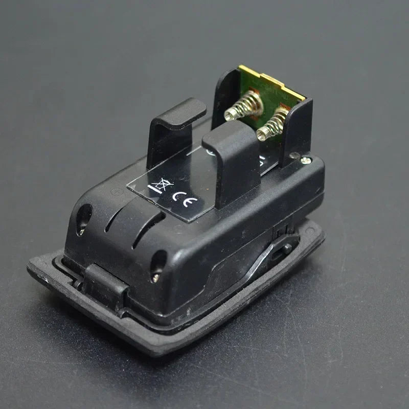 Black plastic car power outlet adapter with metallic spring contacts and green circuit board for acoustic guitar preamp eq pickup