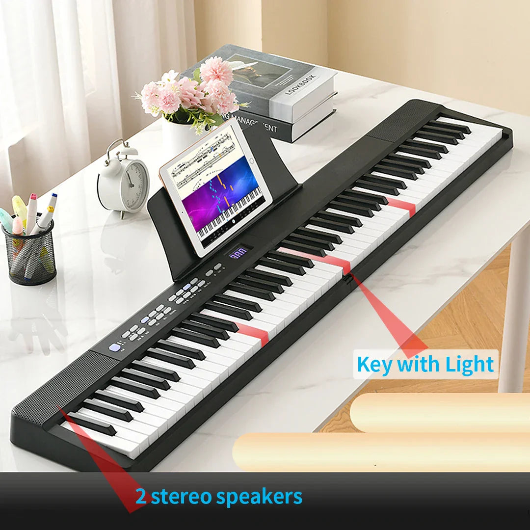 Black and white 61-key foldable musical keyboard with illuminated keys and built-in speakers for professional midi controller use