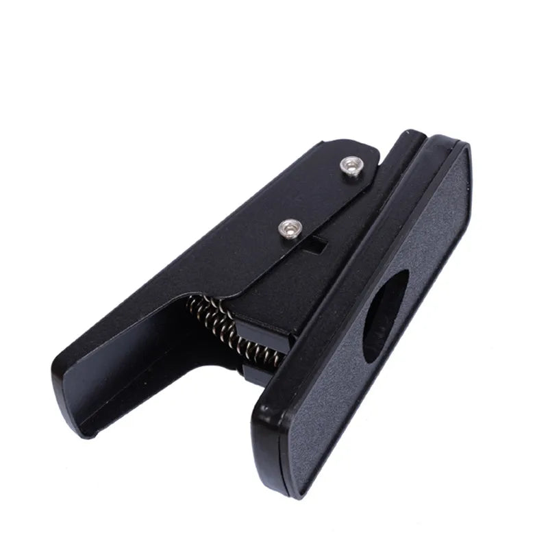 Black plastic plectrum punch with spring mechanism and silver screws for pick punch diy and guitar tools card cutting