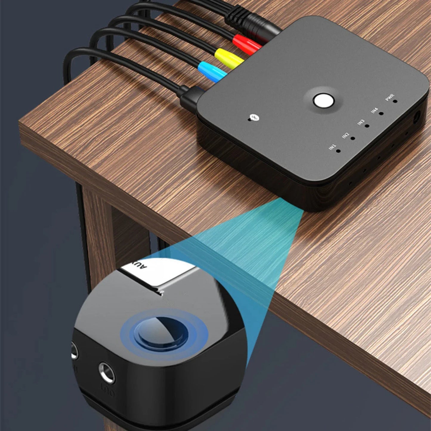 Black rectangular aux audio switcher with colorful rca cables and button for wireless music bluetooth audio receivers remote