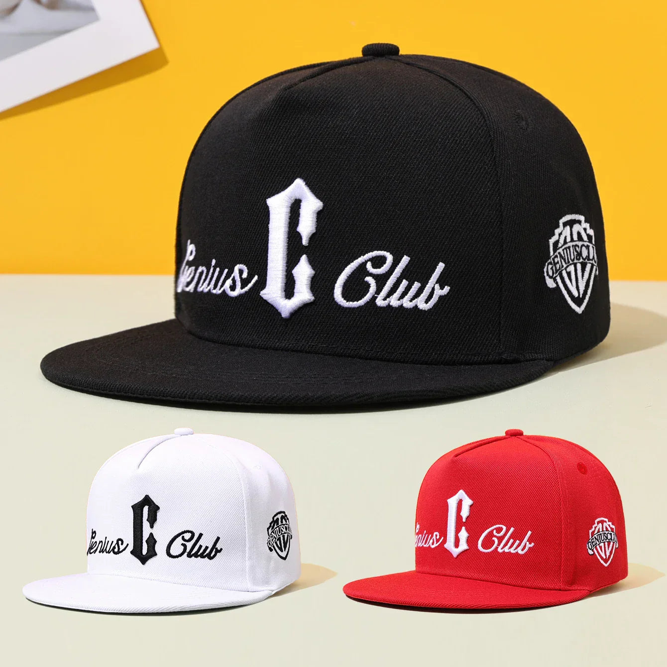 Black hip hop baseball cap with white embroidered genius club logo and shield emblem, flat eave duckbill, street casual embroidered style