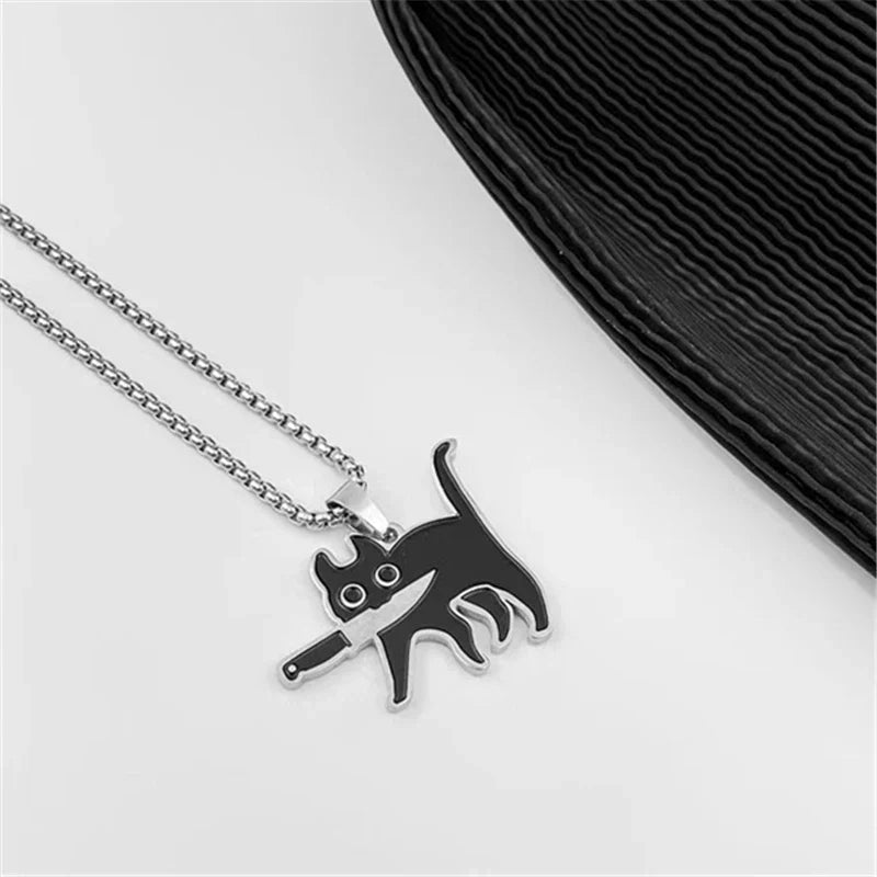 Silver chain necklace with black cat sweater pendant featuring white eyes and knife in hip hop fashion style