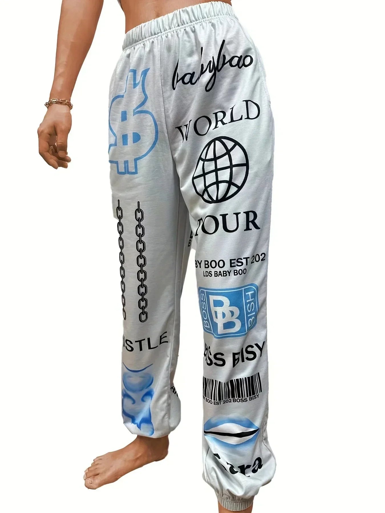 White graphic sweatpants featuring bold blue and black logos and symbols in jogger trousers harajuku style high waist design