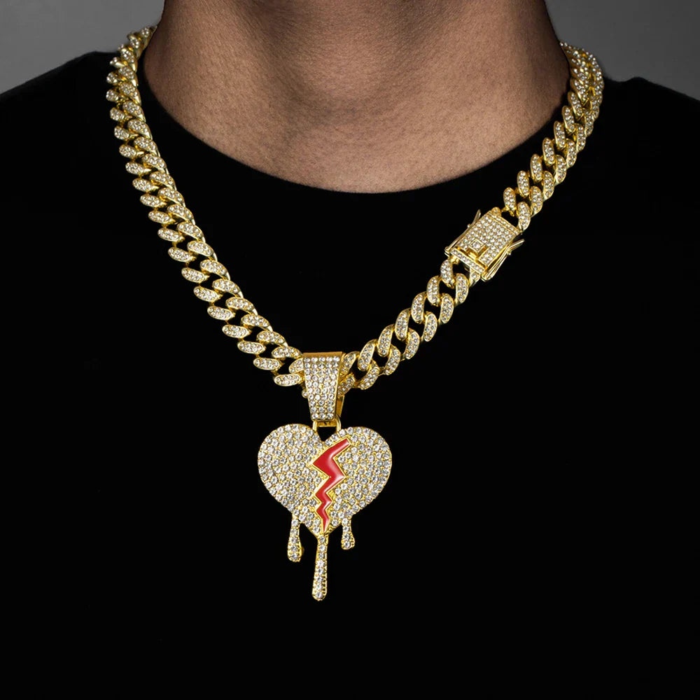 Gold-colored hip hop iced out broken heart pendants necklace with clear crystals and red enamel on miami cuban link chain
