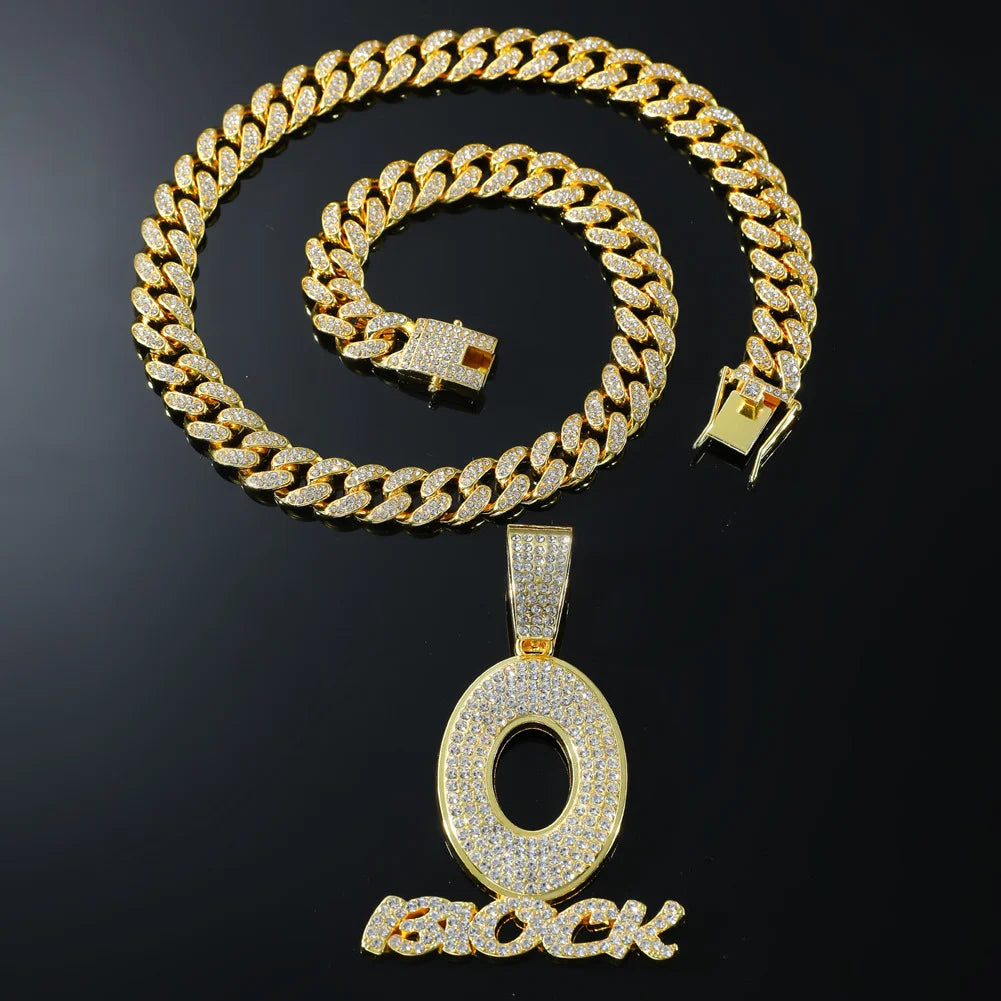 Gold-colored cuban link chain with diamond encrusted o pendant and block lettering hip hop men’s streetwear necklace