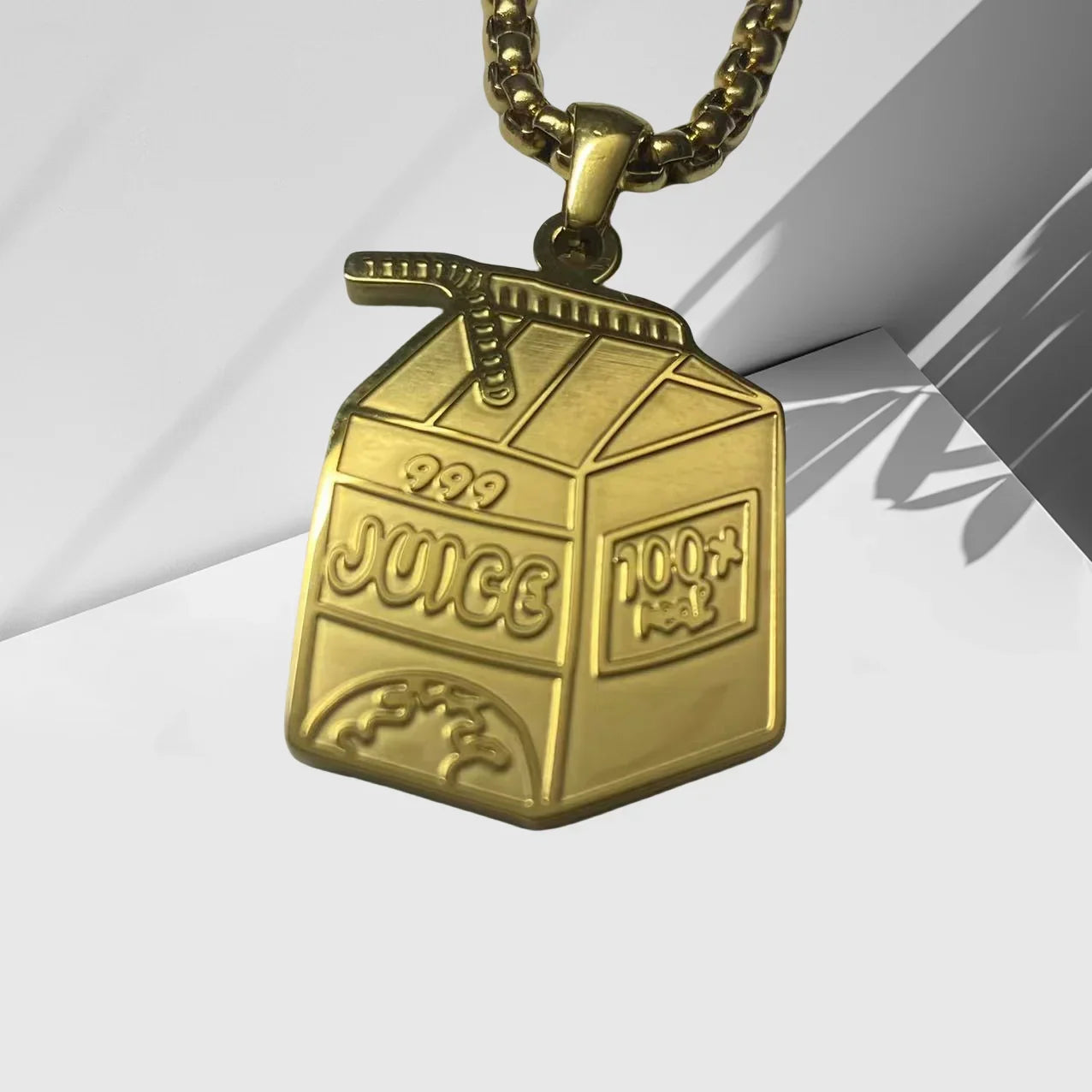 Gold-colored hip hop pendant necklace shaped like a juice box with embossed details for fans memorial jewelry gifts