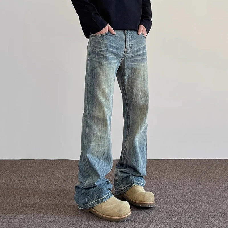Washed blue denim hiphop bootcut jeans with relaxed straight-leg cut and frayed cuffs in classic high quality design