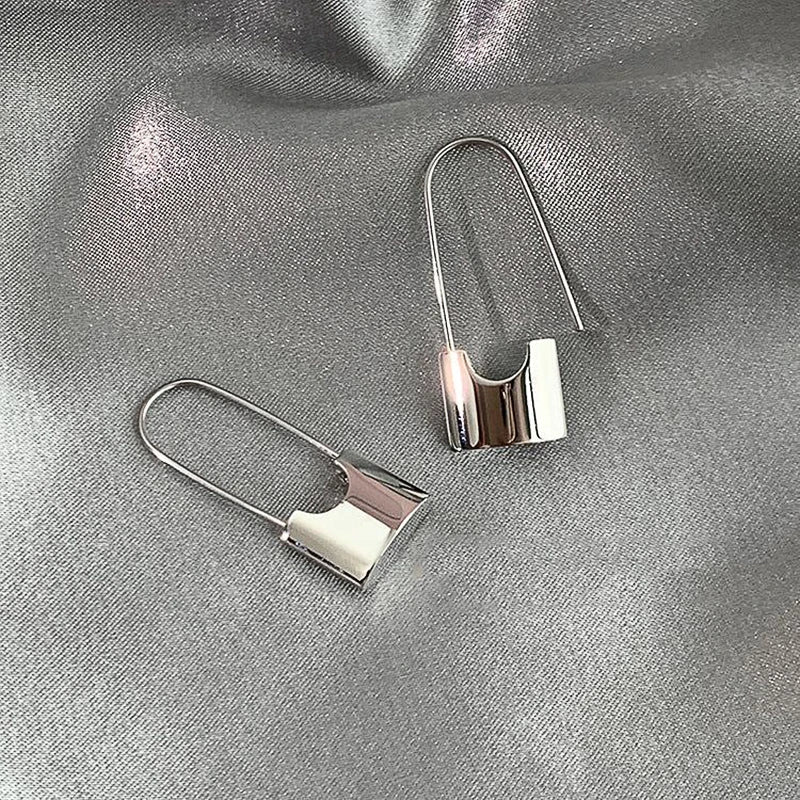 Silver and white huitan hip hop safety pin earrings with a sleek metallic design piercing cool accessories for women