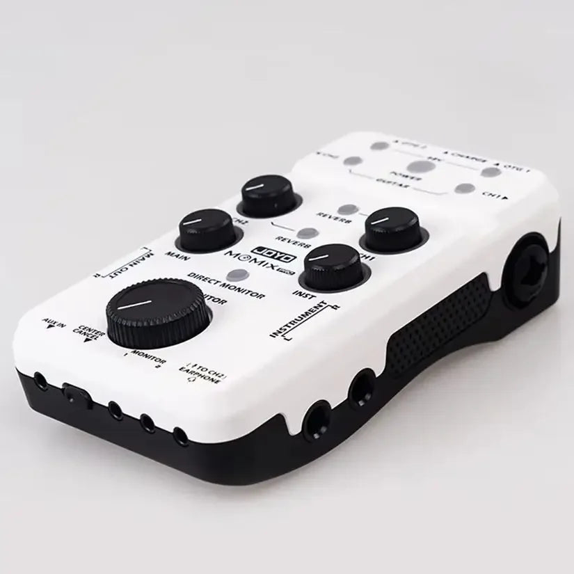 White and black joyo momix pro audio mixer with multiple knobs and jacks for guitar keyboard musical instrument use