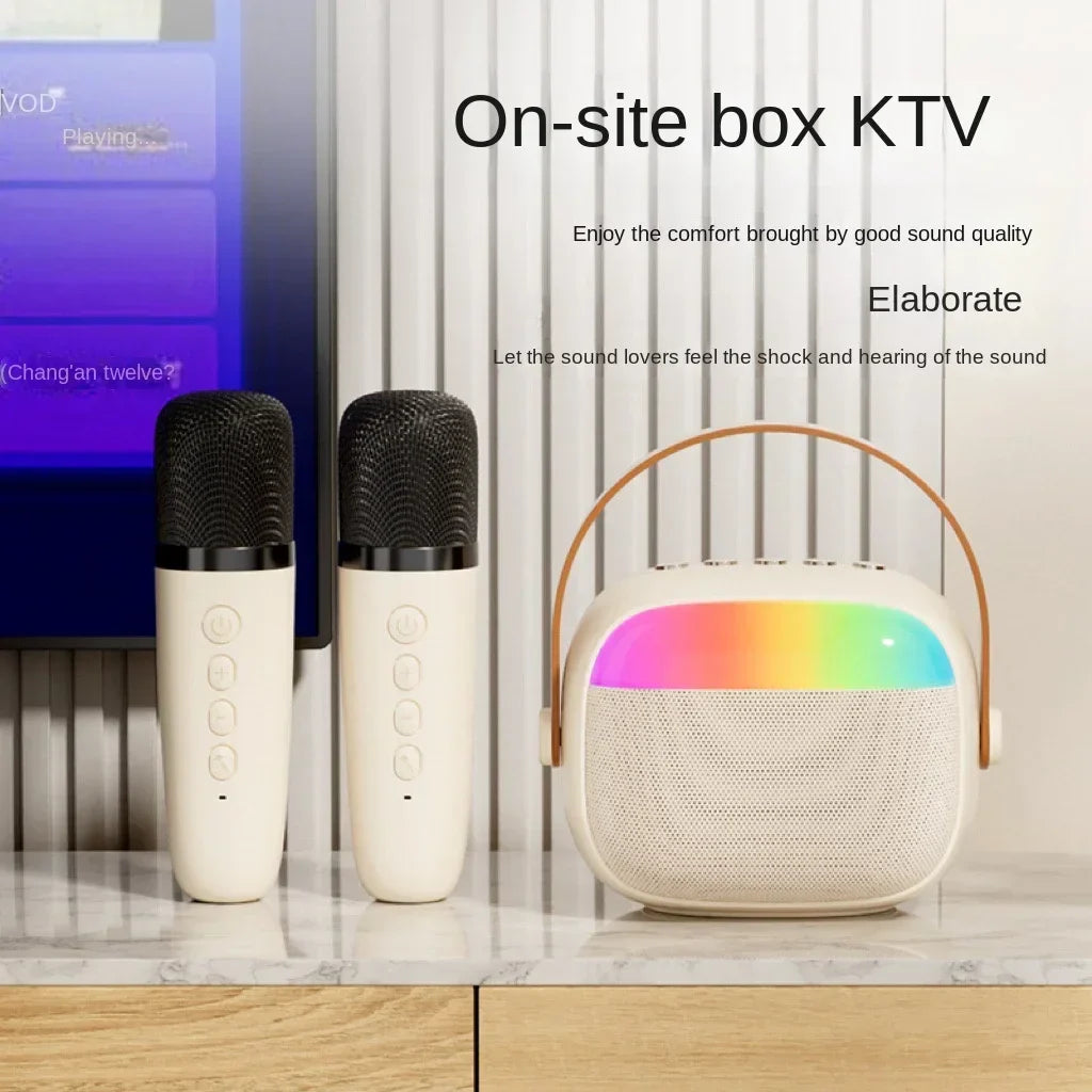 White wireless microphones home with black mesh grilles and beige k30 karaoke machine featuring rainbow led lighting
