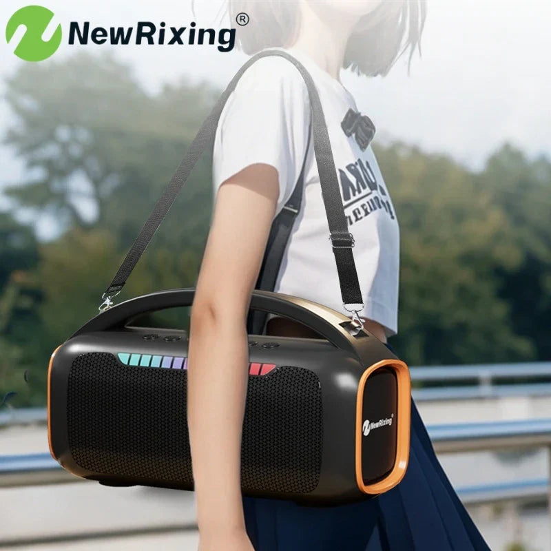 Black and orange portable bluetooth karaoke machine with textured grille, carrying strap, rgb light, and automatic connection