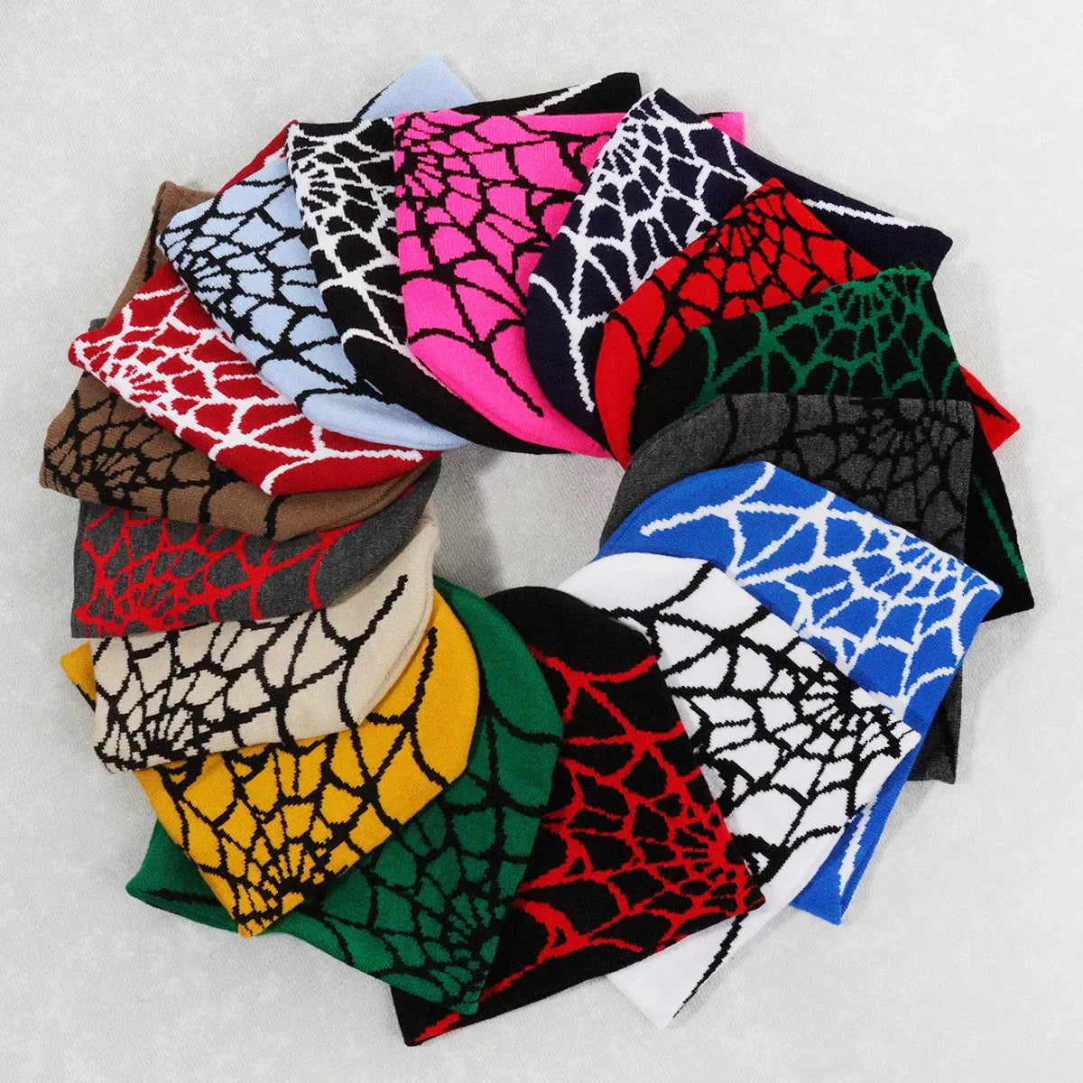 A circular arrangement of colorful knitting spider web pile cap y2k socks in pink blue green red and black hues