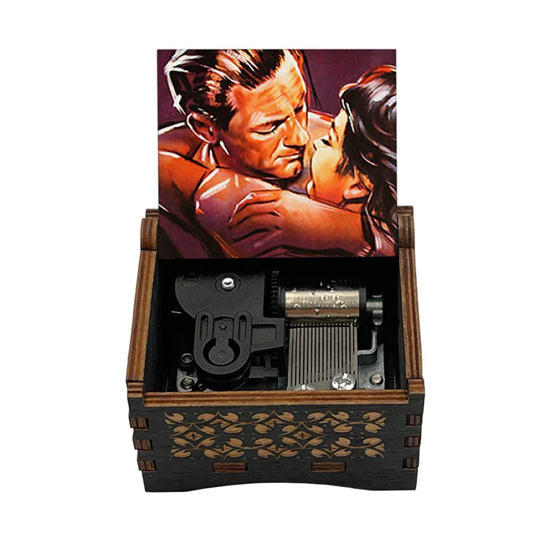 Dark wood music box with decorative front and open lid showing romantic illustration plays famous movie melody for fans girlfriend couple