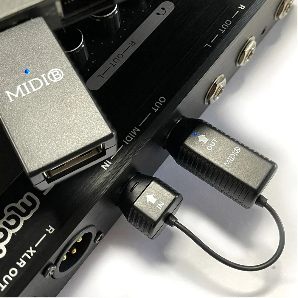 Black midi adapter 5-pin with textured grip and blue led wireless midi bluetooth midi adapter for piano and ios devices