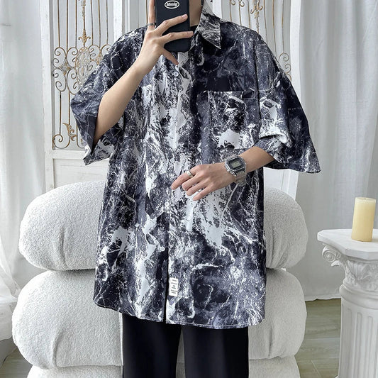 Black and white marble-patterned short-sleeved button-up shirt with a relaxed fit for casual streetwear use