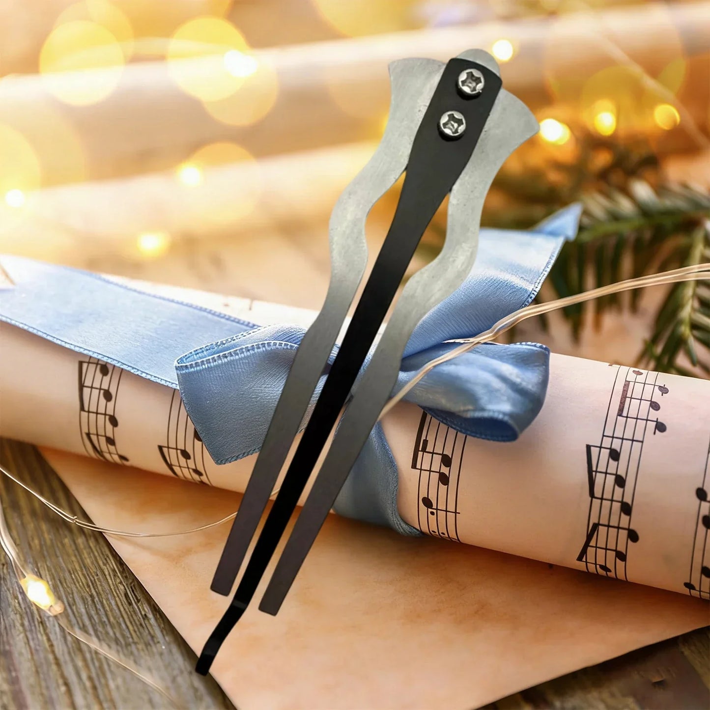Black metal jaw harp with sleek curved design and silver screw accents beginner friendly mouth music instrument