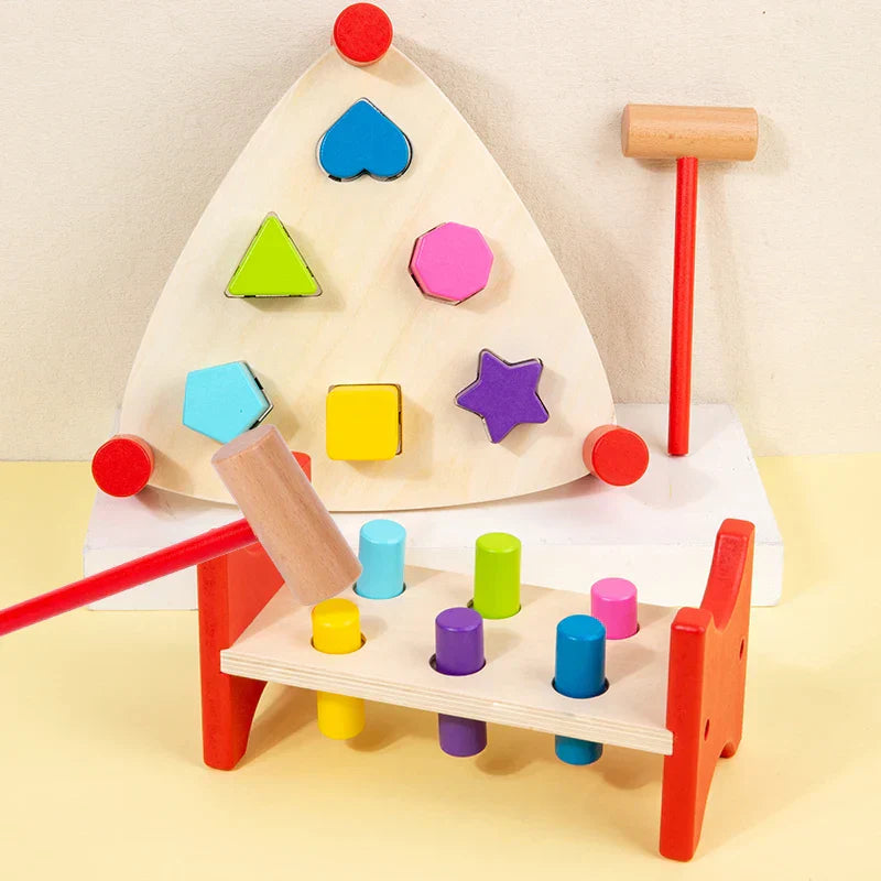Montessori-style wooden early learning percussion table with colorful blocks and red-handled hammer toy educational instrument
