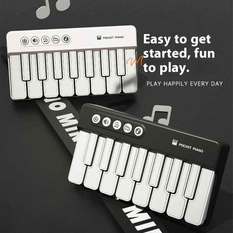 White and black portable musical learning toy piano with compact keyboard and abs texture for building basic music skills