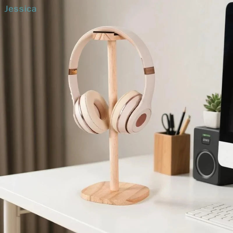 Natural wood headphone stand with stable base holding white gaming over-ear headphones with gold accents wooden earphone frame