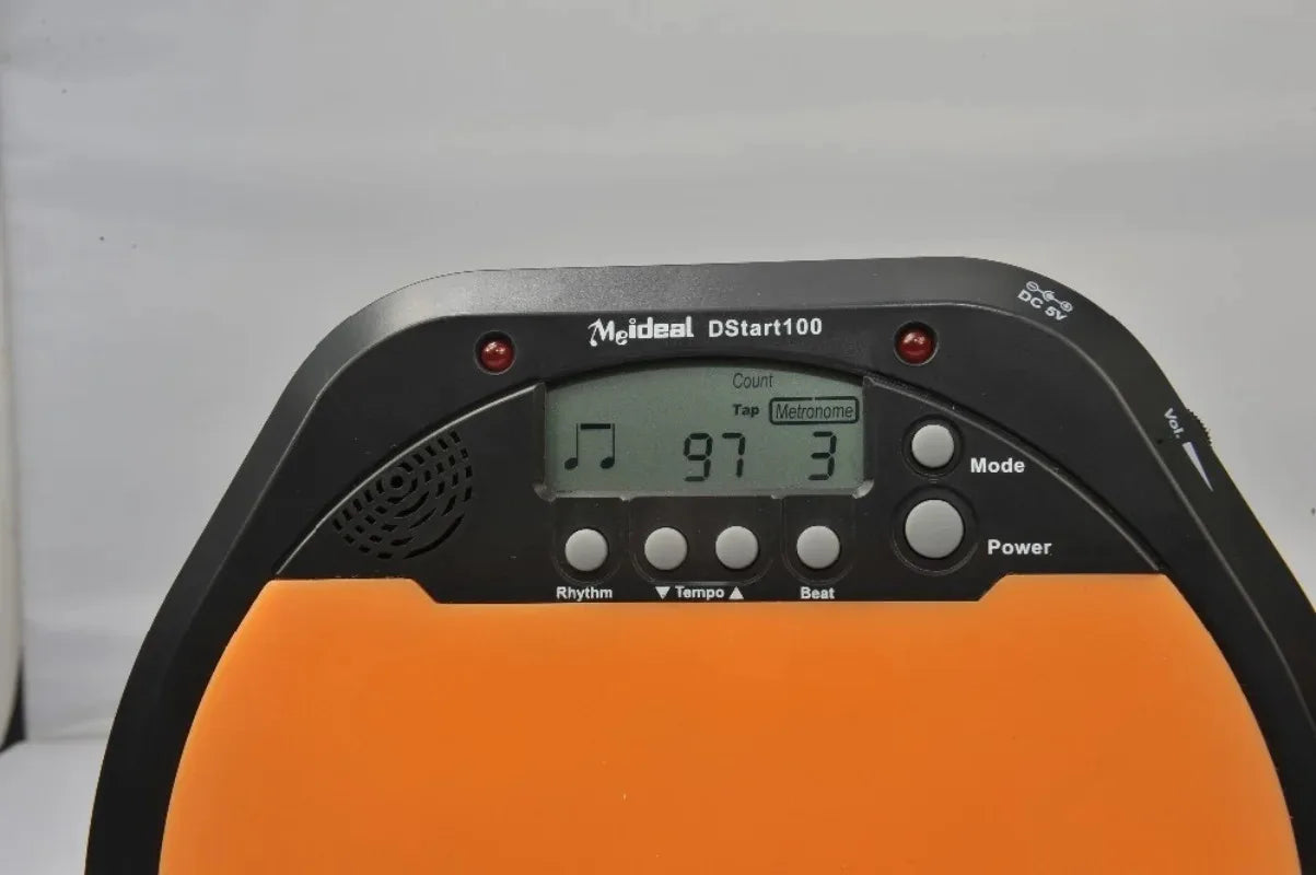 Orange and black Meideal portable DS100 electronic drum training pad with digital tempo display for drum training use
