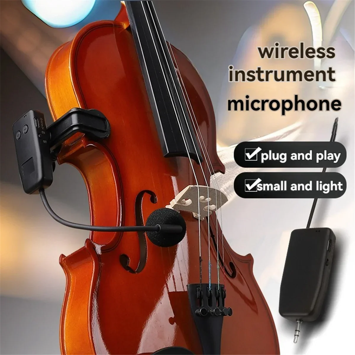 Black wireless violin microphone with foam windscreen clipped to instrument for stage performance audio receiver use