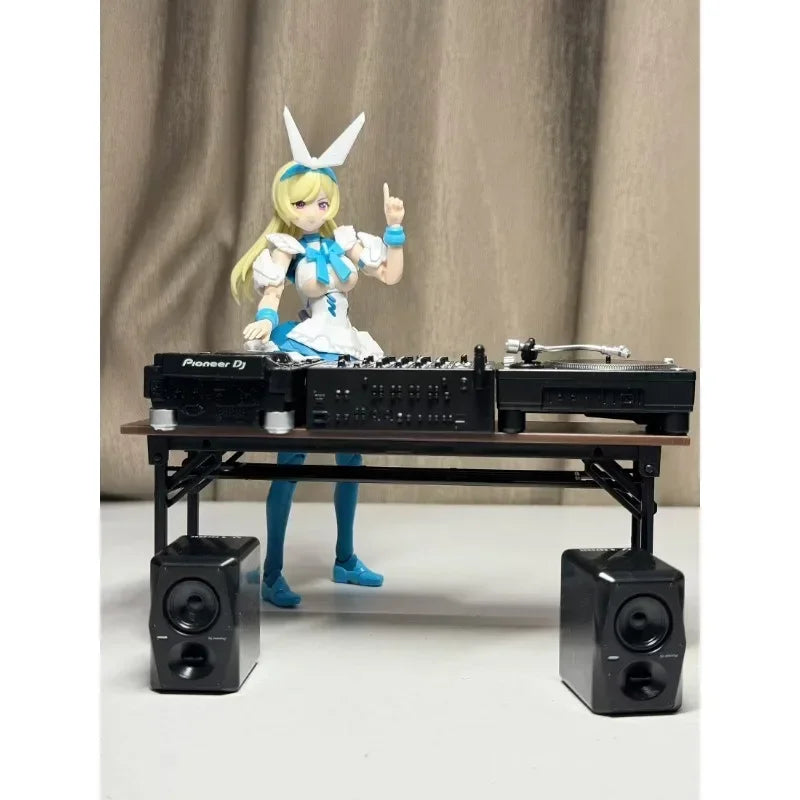 A blonde anime dj figure with bunny ears in blue and white stands behind a pioneer dj pioneer candy toy model equipment antenna mixer