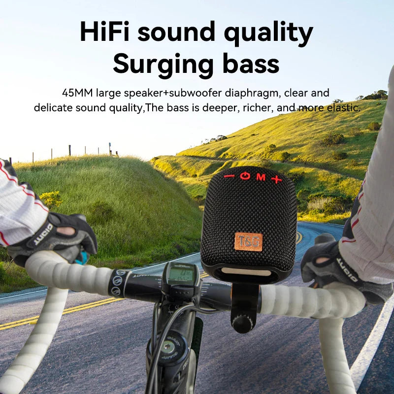 Black mesh-textured portable bluetooth speaker wireless with orange logo control buttons radio fm subwoofer woofer mini waterproof