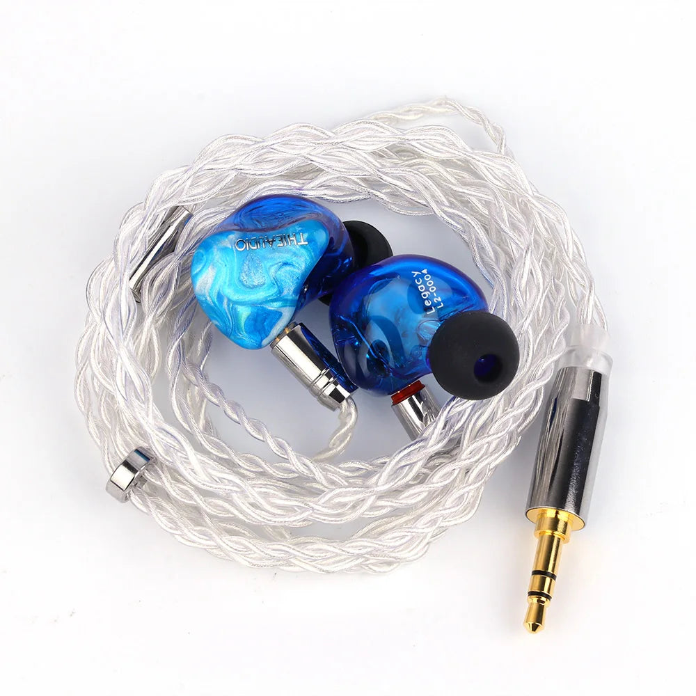 Blue translucent marble-patterned Thieaudio Legacy hybrid in-ear monitor with silver fittings and braided white cable for audiophiles musicians