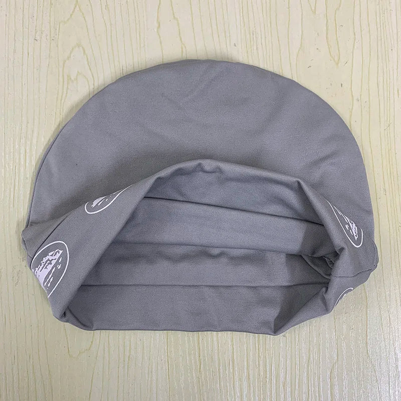 Gray fabric retro hip hop pullover hat with white circular logos on folded edges for men and women
