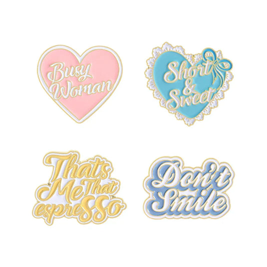 Set of four sweet enamel pins in pastel pink blue gold and lavender featuring heart and script designs for smile brooches clothes