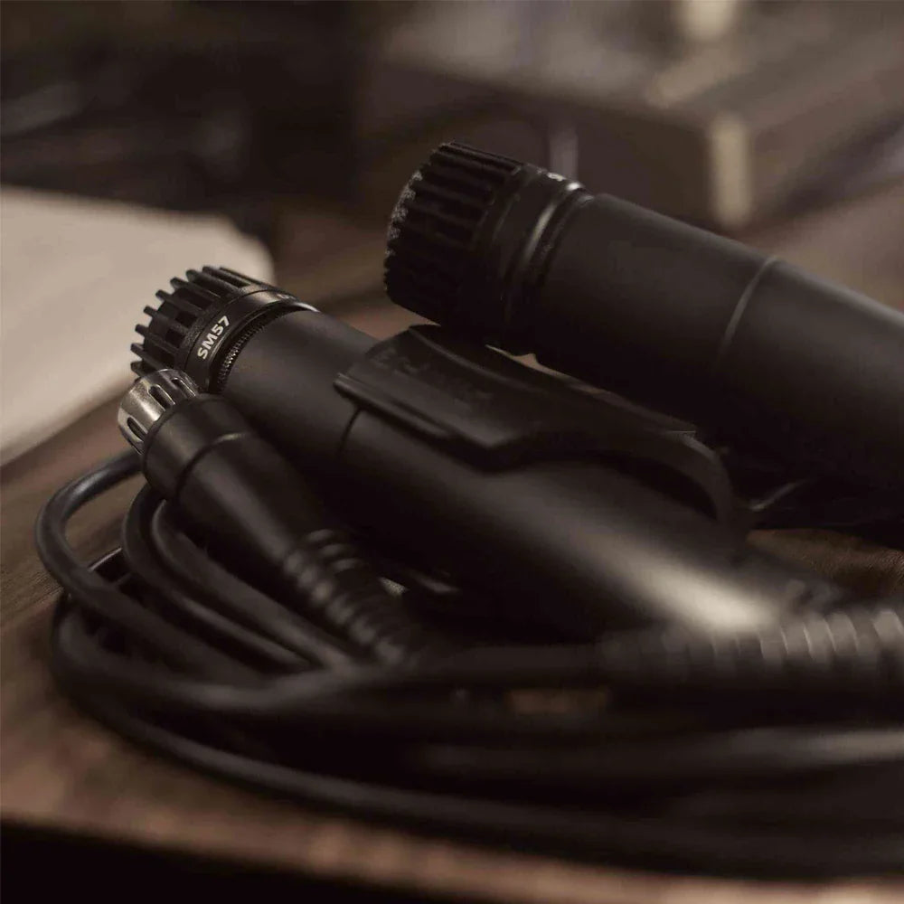 Black sm57 dynamic instrument microphones with textured grille and coiled cables for professional instrument recording and type beat music