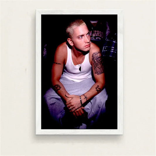 White-framed canvas painting of eminem in a white tank top with tattoos for bedroom wall art featuring color change effect