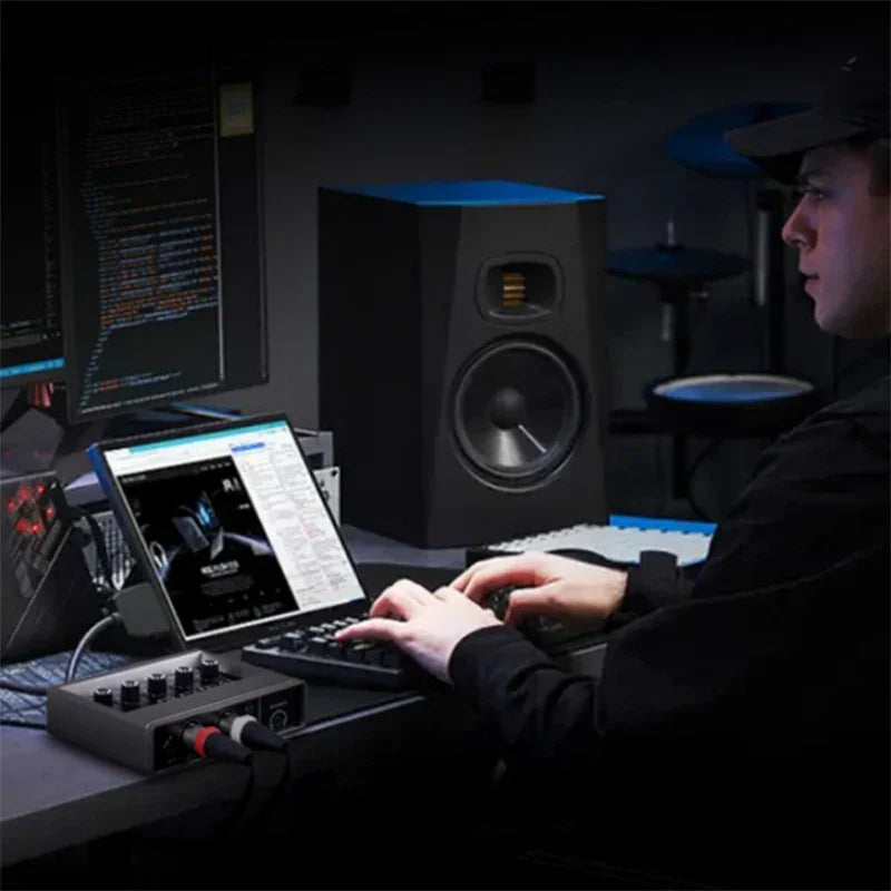 Black studio monitor speaker with blue top and gold grille for professional audio sound and live broadcast studio use